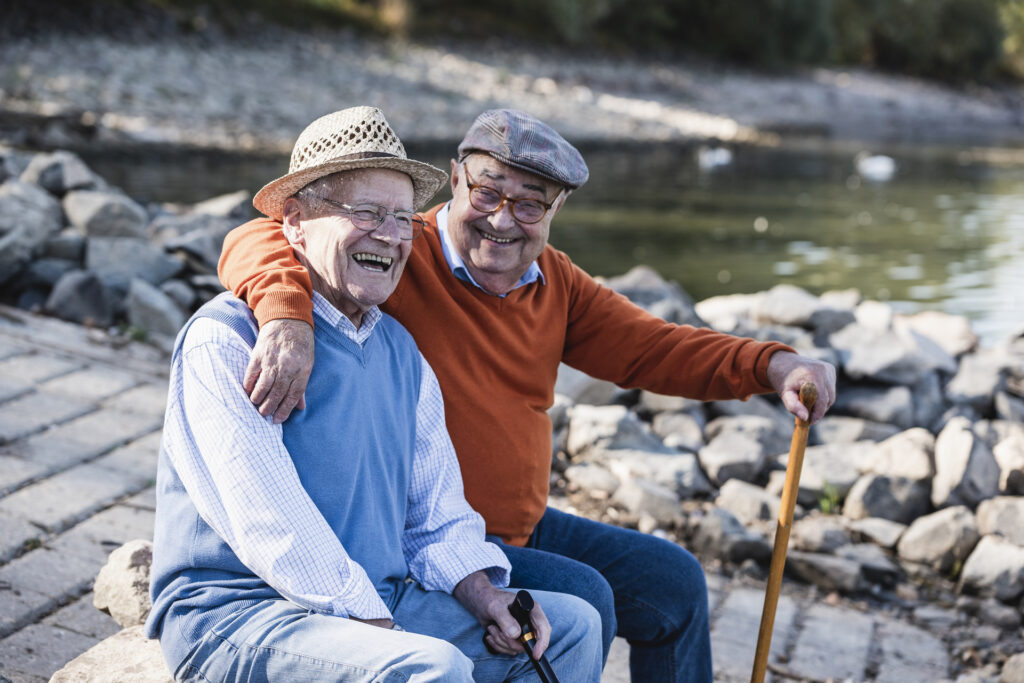 Two old friends sitting by the riverside